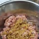 Mix finely minced dongcai with the seasoned minced pork