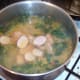 Sliced chicken sausages are added to soup