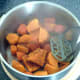 Mashing sweet potatoes and carrot