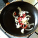 Sauteeing prepared chilli, garlic and onion
