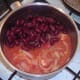 Kidney beans are added to tomatoes and onion