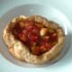 Spicy vegetables are poured in to giant Yorkshire pudding