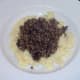 Haggis spooned on to mustard mash bed
