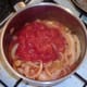 Tomatoes added to sauteed onions