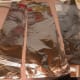 Prepare three narrow strips of aluminum foil to protect the crust from burning.