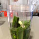 Take the pandan leaves and place them into a blender. Pour in some water and blend until fine.