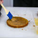 Soaking the cake layers with syrup (Step 13).