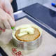 Adding the upper layer and covering with mousse (Step 19).