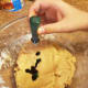 Add a generous amount of green food coloring to the cookie dough.