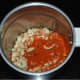 Add the peanuts, red chili powder, garlic, and cumin seeds to a blender. Pulse 2–3 times to get a coarse powder. Add salt and pulse once again.