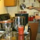Add hot water to the canner to cover the jars.
