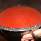 After evaporation, the sauce is a beautiful red color. Bring it back inside to finish on the stove.