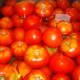 Wash the tomatoes and let them sit in a cold water bath.
