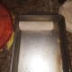 Adding enchiladas to pan