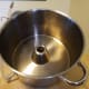 The steam rises through the hole in the center of the middle pan. Juice collects in the middle pan and can be emptied through the silicon tube.