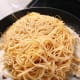 Toss the pasta into the mixture.