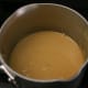 (Step 4) The caramel sauce after the salt, vanilla, and sweetened condensed milk have been added.