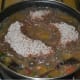 Keep the heat medium low. Cover the pan and cook for about 8 minutes. Afterward, open the lid and quickly mix the contents. This way, the uncooked flour cooks properly.