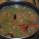 Step 3: Add two bowls of water. Let it come to a gentle boil.