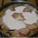 Step 4: Add finger millet flour at once in the center. Don't spread it. Make a deep hole in the center of the flour.