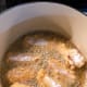 Place coated chicken pieces into the pan gently, using tongs, to avoid splashing oil.