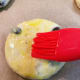 Brush the tops with the egg wash.