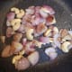 Add cashews. Saute till they turn golden brown. Set aside to cool.