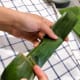 Flatten both edges and secure by folding them.