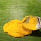 Take a spoonful of the mixture and spread on the banana leaf.