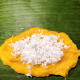 Add two teaspoons or more coconut filling in the middle of the mixture.