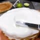 Smooth the frosting with icing spatula.