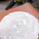 Take some fresh grated lime zest and sprinkle on top of the first cake.