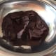 Melting semi-sweet dark chocolate couverture or glaze.