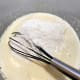 Gradually add the flour mixture into the batter.