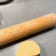 Cut the dough into a few pieces. Use a rolling pin to flatten the dough.