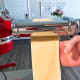 Pass it through the widest setting again with the seam of the letter perpendicular to the rollers.