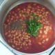 Parsley and black pepper is added to beans