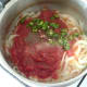 Tomatoes and chilli are added to sauteed onion