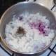 Red onion and mint are added to mash