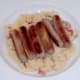 Sausages are laid on chilli and mustard mash
