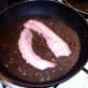 Bacon is fried in liver juices