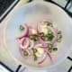 Red onion and green chilli trivet for baking chicken thighs