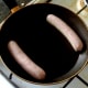 Sausages are put on to fry