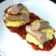 Sliced sausages are arranged on stuffed mushrooms