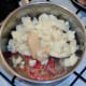 Mustard and mash are added to sauteed onion and chilli