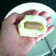 Cocktail sausage is pushed into mashed potato