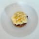 Burger is plated on toast disc
