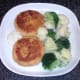 Pollack and tarragon fishcakes are served with cauliflower, broccoli and tartare sauce