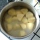 Chopped potatoes are steeped in cold water