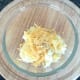 Cheese and black pepper are added to mash